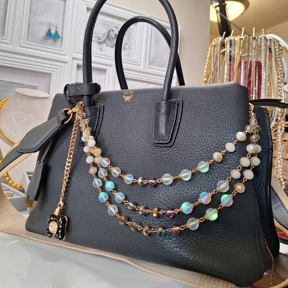 MCM Elegant Gray Leather Handbag with Gold Accents